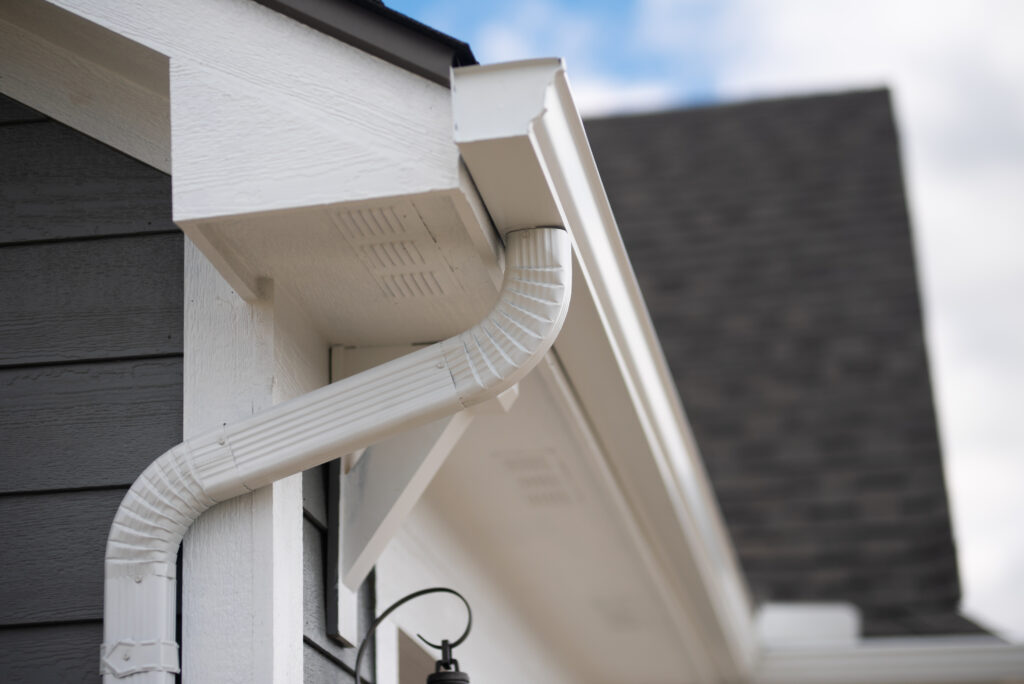 White seamless gutter and downspout